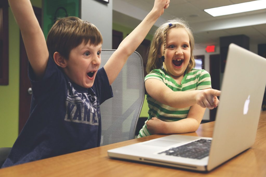 Kids excited at computer